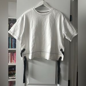 NWOT | White crop top t shirt with ribbon side slit | Fits Women’s M - L